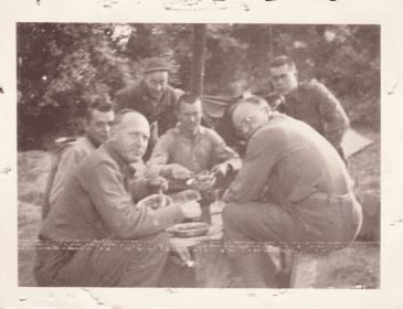 photo-0606-2014-wwii-normandy-soldiers photo of Scott Phillips'sfather having lunch somewhere in Normandy with his squad during WWII