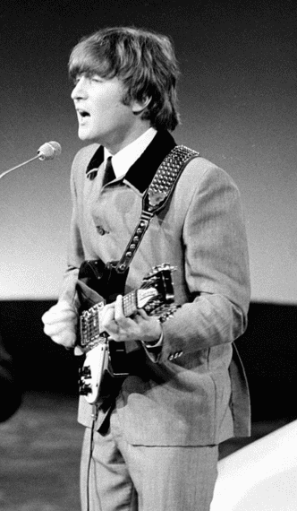 photo-1208-2014-john-lennon photo: ofJohn Lennon performing with the Beatles in 1964