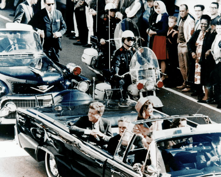 Photo: President Kennedy in the limousine in Dallas, Texas, on Main Street, minutes before the assassination. Also in the presidential limousine are Jackie Kennedy, Texas Governor John Connally, and his wife, Nellie, 22 November 1963