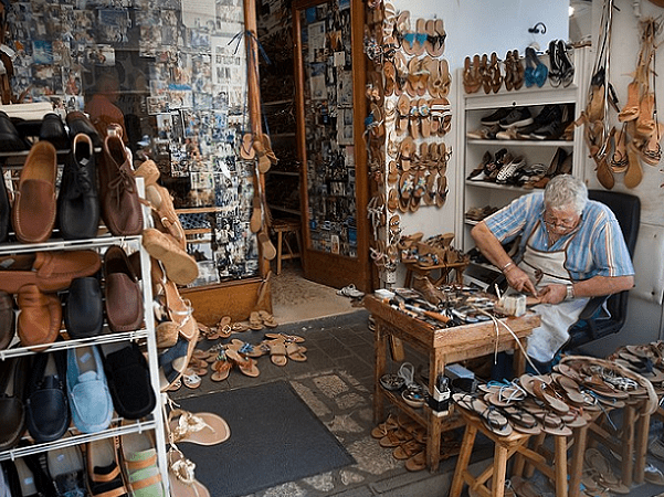 Photo: a cordwainer making shoes, Capri, Italy. Credit: Jorge Royan; Wikimedia Commons.