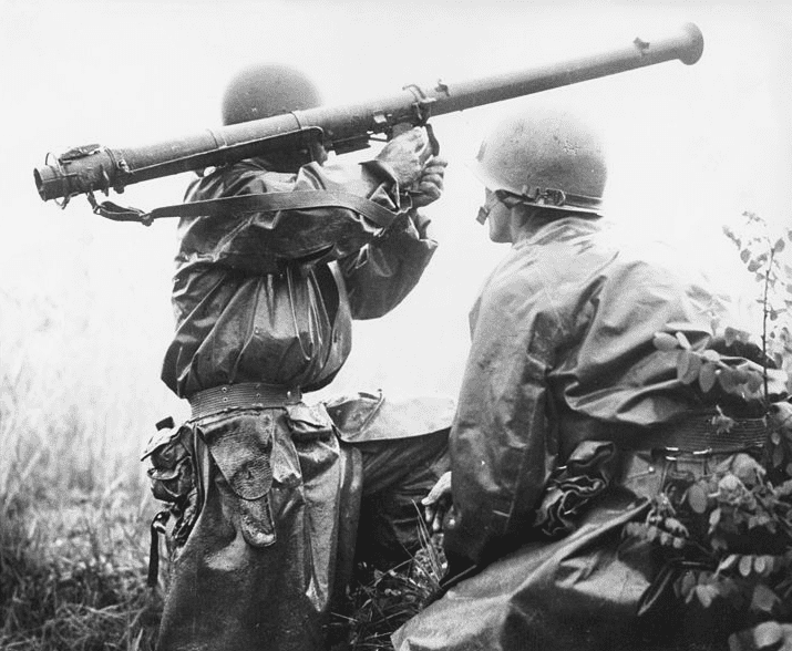 Photo: a team mans a bazooka at the Battle of Osan. Members of the 24th Infantry Division, first United States ground units to reach the front, go into action against North Korean forces at the village of Sojong-Ni, near Osan