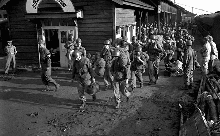 Photo: Task Force Smith arrives in South Korea: the first units of U.S. Army ground forces to arrive debark from trains in Taejŏn, South Korea, 1950