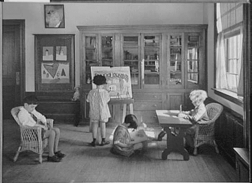 Photo: children painting, reading and writing, between 1930 and 1940