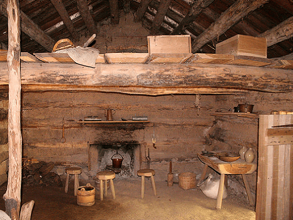 Photo: interior of a recreation of a log cabin at Conner Prairie living history museum in Fishers, Indiana
