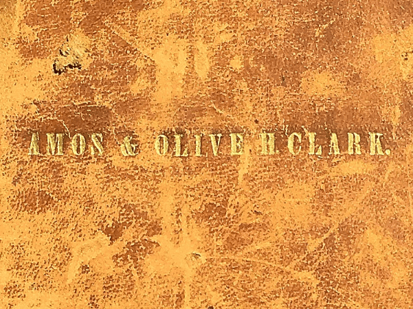 Photo: cover of the family Bible of Amos and Olive Clark.