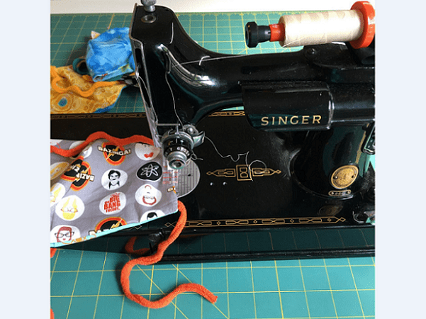 Photo: sewing a coronavirus mask. Credit: Denise Levenick.
