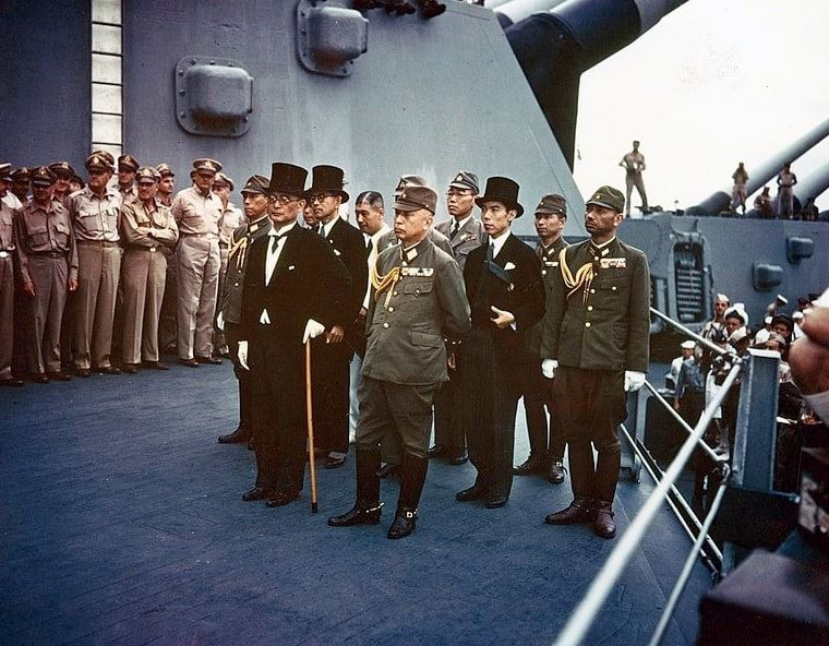 Photo: representatives of the Empire of Japan stand aboard USS Missouri prior to signing of the Instrument of Surrender, 2 September 1945