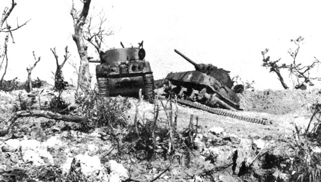 Photo: two U.S. M4 Sherman tanks knocked out by Japanese artillery at Bloody Ridge during the Battle of Okinawa, 20 April 1945