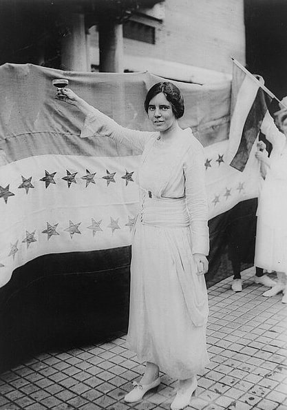 Photo: Alice Paul toasting (with grape juice) the recent passage of the Nineteenth Amendment, 3 September 1920