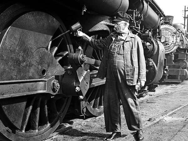 Photo: a railroad worker for the Southern Pacific Railroad Company. Credit: DeGolyer Library, Southern Methodist University; Flickr the Commons.