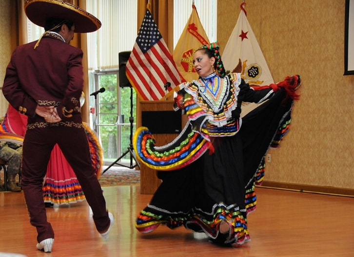 Photo: Mexican Dance Ensemble, Los Quetzales, performs at the Fort Belvoir, Virginia, Hispanic American Heritage Month observance. Credit: Ashley Henry; U.S. Army; Wikimedia Commons.