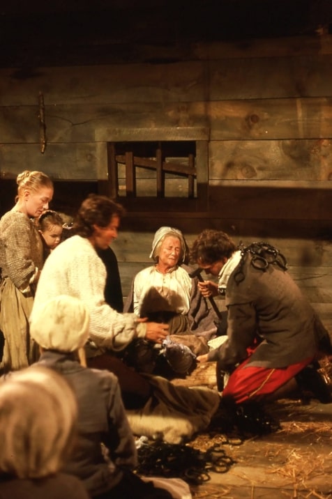 Photo: manacles being applied to Rebecca Nurse (Phyllis Thaxter) in jail in a scene from “Three Sovereigns for Sarah.” Credit: Richard B. Trask