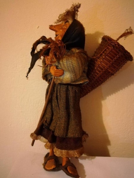 Photo: a wooden puppet depicting the Befana, from Italian Epiphany folklore. Credit: Tiguliano; Wikimedia Commons.