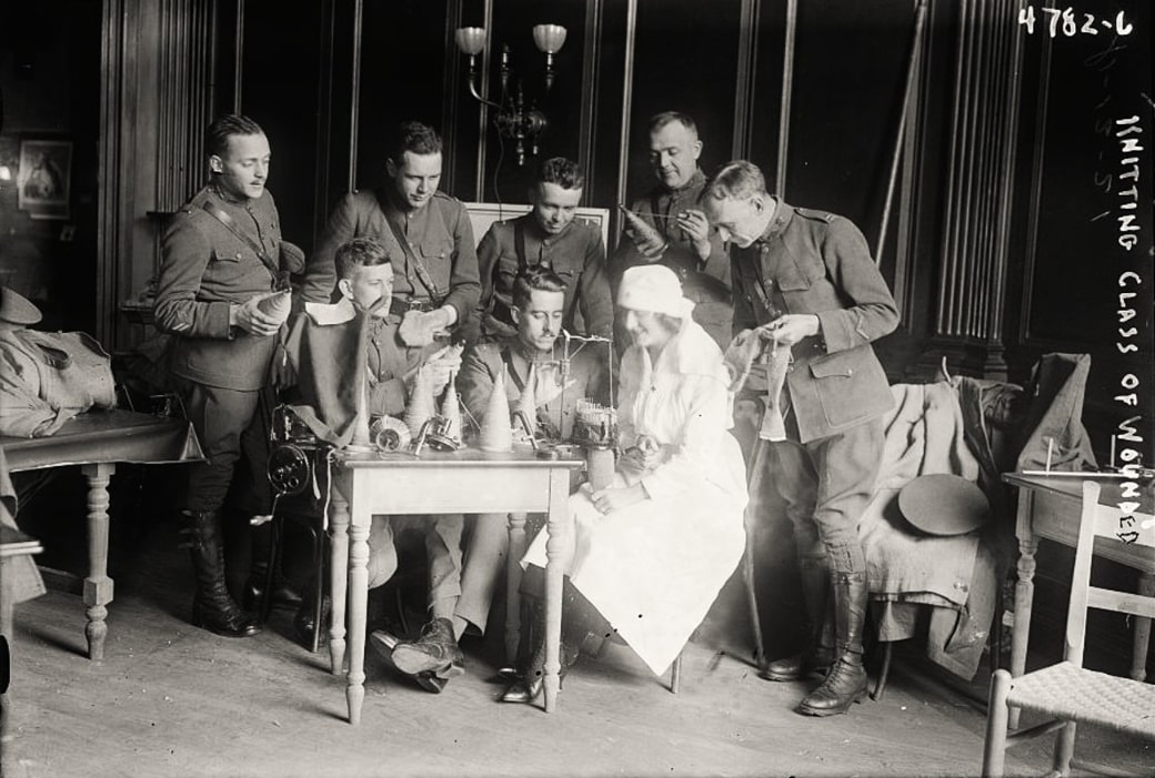 Photo: Red Cross knitting class for wounded WWI soldiers. Credit: Library of Congress, Prints and Photographs Division.