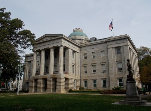 Photo: the North Carolina State Capitol in Raleigh, North Carolina. Credit: Farragutful; Wikimedia Commons.
