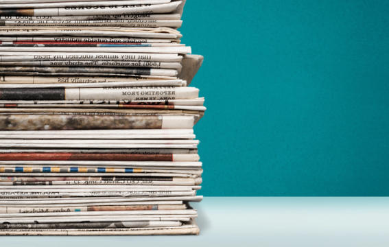Photo: a stack of newspapers. Credit: https://depositphotos.com/home.html