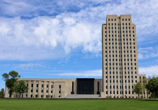 Photo: the North Dakota State Capitol in Bismarck, North Dakota. Credit: Farragutful; Wikimedia Commons.