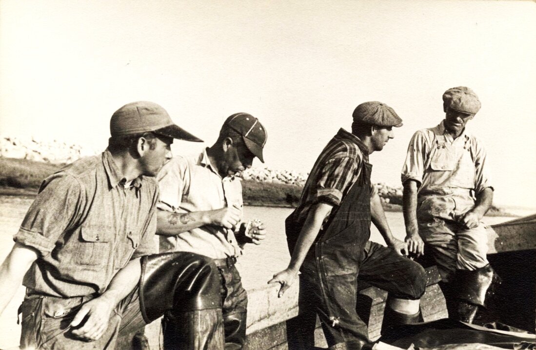 Photo: Than Wixon with fellow fishermen. Credit: Jennifer (Koehler) Mackall.
