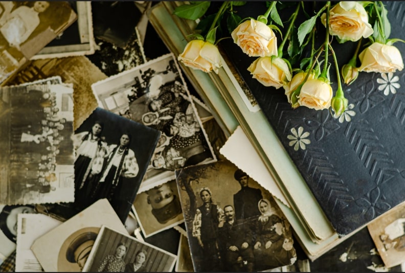 Photo: photos, journal and flowers.