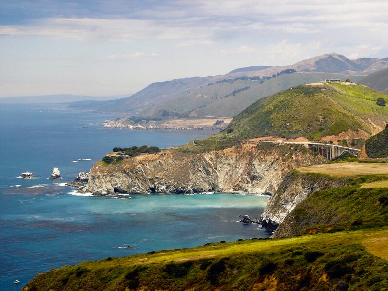 Photo: Big Sur, including the Bixby bridge, on the Central Coast of California. Credit: Calilover; Wikimedia Commons.